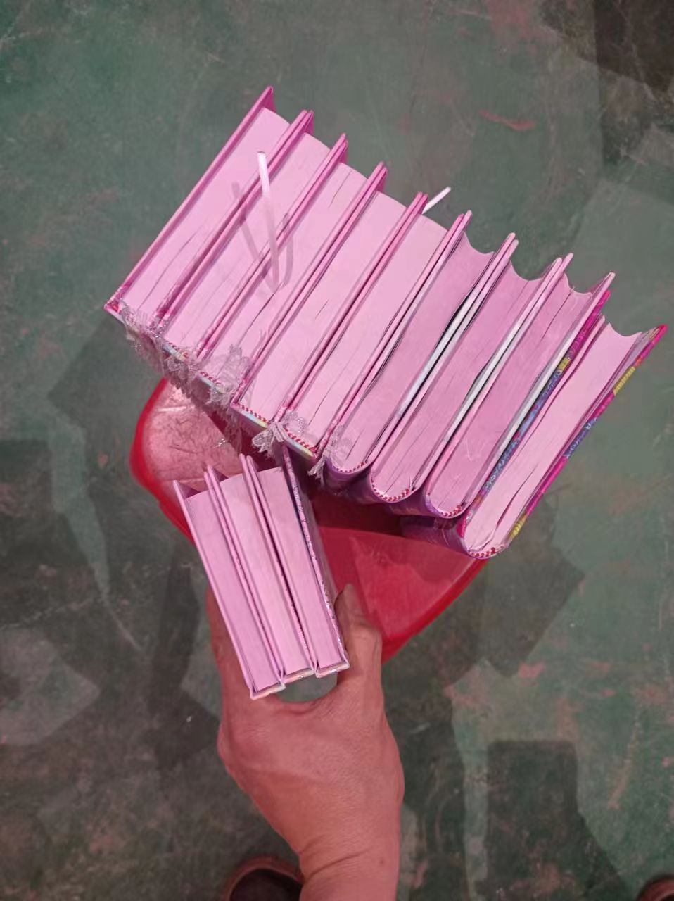 A collection of well-organized bound books on a shelf