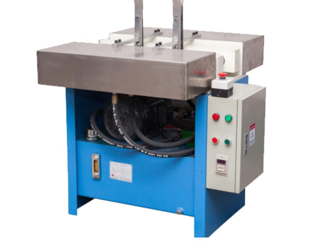 Book spine rounding and backing machine