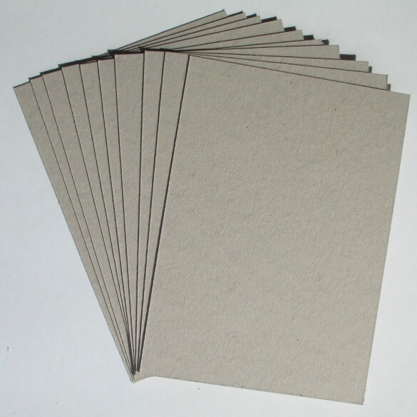 Stacks of greyboard chipboard material